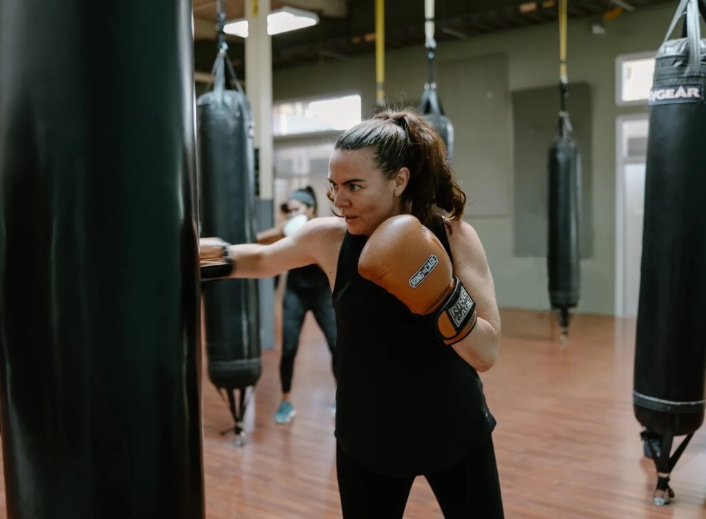 A participant training on a heavy bag at Westside Fitboxing